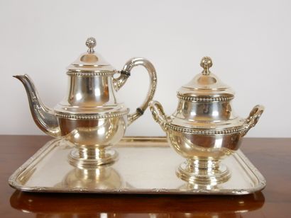 null 
Silver plated metal tea set decorated with rows of pearls, including a teapot,...