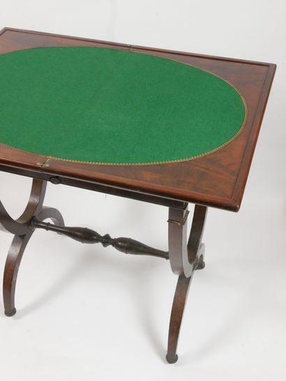 null 
Rectangular mahogany veneer game table opening with a wallet top and a drawer...
