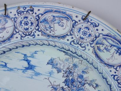 null NEVERS :

Large round earthenware dish with blue monochrome decoration of an...