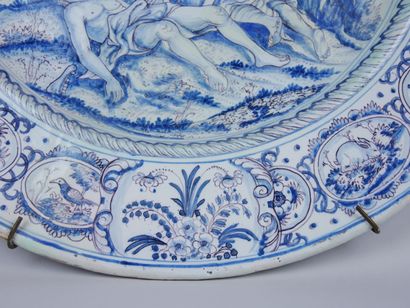 null NEVERS :

Large round earthenware dish with blue monochrome decoration of an...