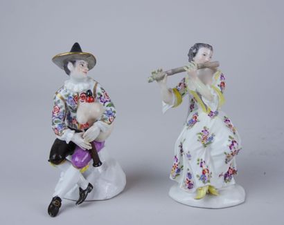 null MEISSEN: 

Two porcelain statuettes with polychrome and gold decoration representing...