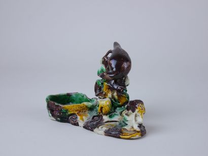 null CHINA:

A sancai enameled porcelain brush washer with an eagle on top.

Kangxi...