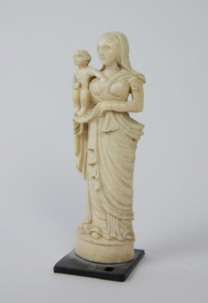 null 
Virgin and child in bone holding the baby Jesus on her right arm. 




Work...