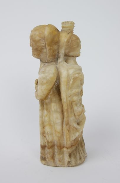 null Alabaster figure carved with two facets, representing a nun on one side and...