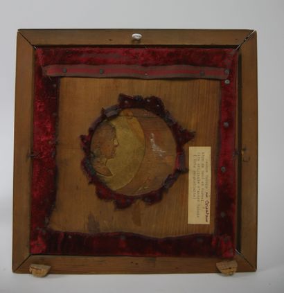 null Wooden medallion representing a lady seen in profile in red wax

Carries on...