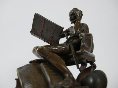 null 
Don Quixote sitting reading Amadis de Gaul.




Bronze sculpture with brown...