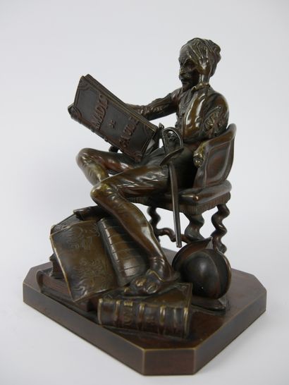 null 
Don Quixote sitting reading Amadis de Gaul.




Bronze sculpture with brown...