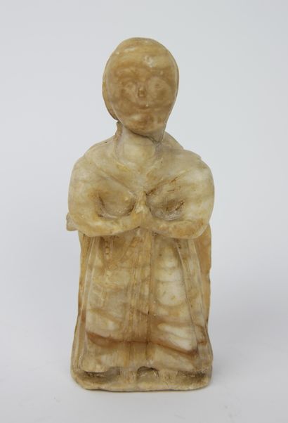 null Alabaster figure carved with two facets, representing a nun on one side and...