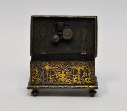 null 
Small rectangular steel chest with gold damascene decoration of satyrs, foliage,...