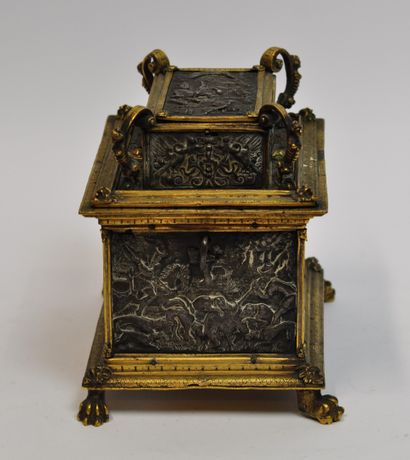 null 
Gilt brass chest decorated with chased metal plates depicting hunting scenes,...