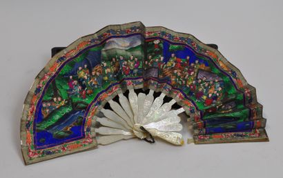 null Mother-of-pearl and paper fan, the frame finely carved with scenes of daily...