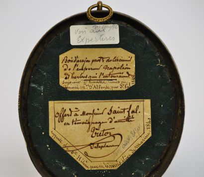 null 
Oval medallion containing a fragment of mahogany wood with the mention "Reported...