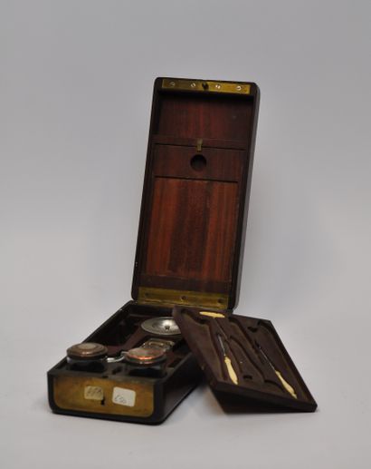 null 
Small rectangular mahogany travel set, inlaid with brass fillet and an escutcheon....