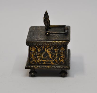 null 
Small rectangular steel chest with gold damascene decoration of satyrs, foliage,...