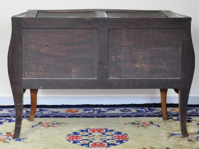 null A veneered chest of drawers with marquetry of flowers opening to two drawers...