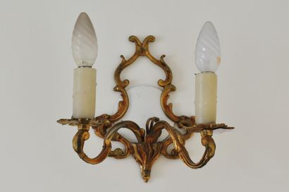 null Five two-light ormolu sconces decorated with scrolls and foliage. Louis XV style....