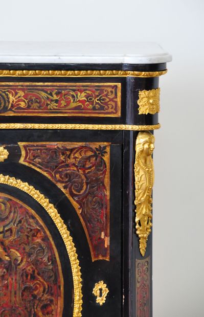 null Blackened wood and gilt brass marquetry on a red painted background imitating...