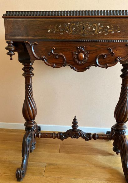 null Mahogany and mahogany veneer working table richly carved with brass and mother-of-pearl...