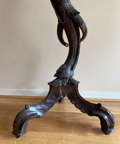 null Natural blackened wood sellette molded and carved with a bacchus in the round,...