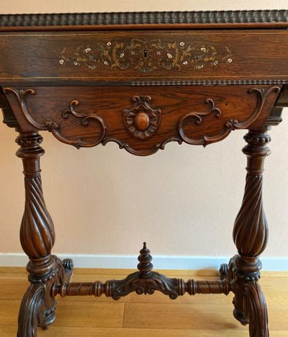 null Mahogany and mahogany veneer working table richly carved with brass and mother-of-pearl...