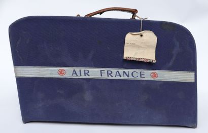 null AIR FRANCE SUITCASE.

Blue canvas with Air France woven band, leather handle....