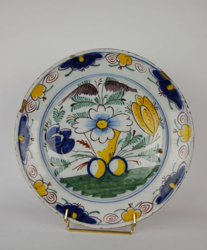 null 
Two earthenware dishes, the first with blue white decoration of flowers and...