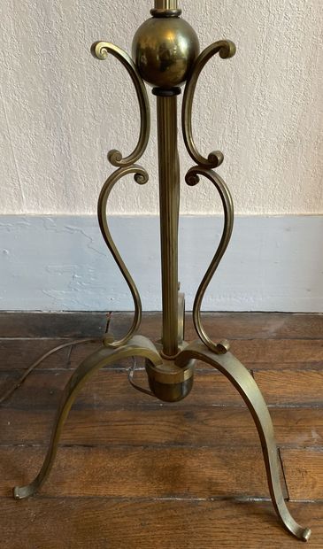 null Floor lamp in gilded metal with 3 lights resting on a tripod base, the shaft...