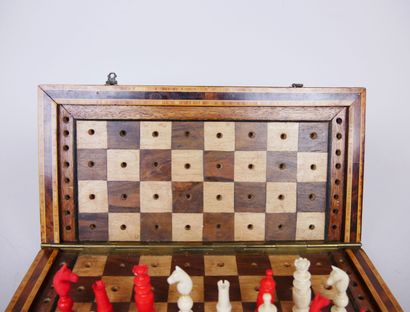 null Mahogany two tone travel chess board, red and white pieces. The exterior covered...