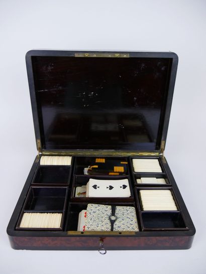 null Wooden game box decorated with ivory marquetry scrolls and brass fillets containing...