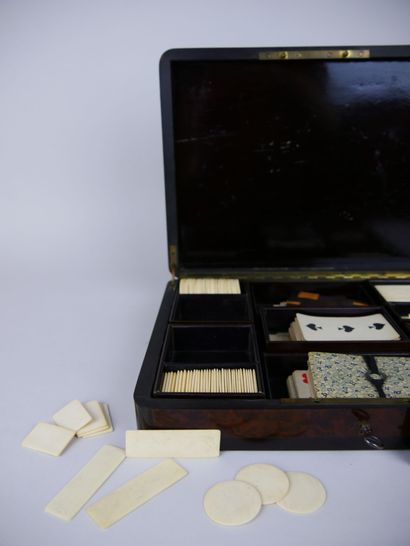 null Wooden game box decorated with ivory marquetry scrolls and brass fillets containing...