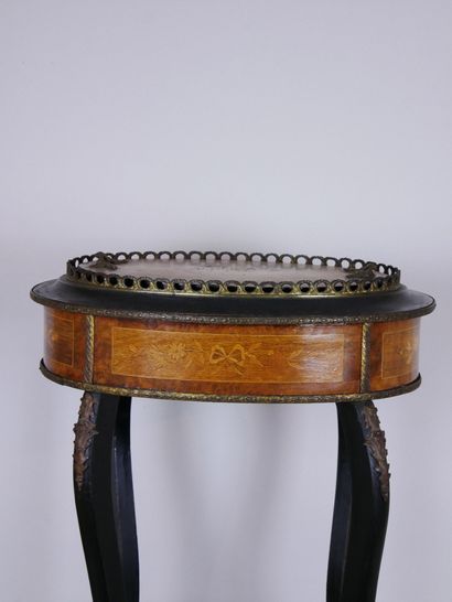 null Oval planter in carved wood of two tones with ribbon decoration in belt, the...