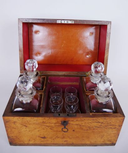 null Liquor cellar in a burl wood box including four bottles and 9 small crystal...