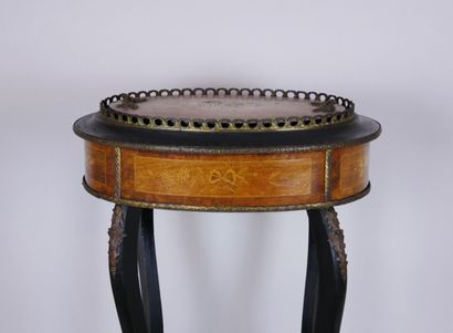 null Oval planter in carved wood of two tones with ribbon decoration in belt, the...