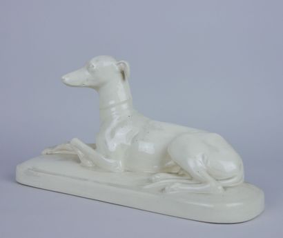 null SARREGUEMINES 

Greyhound lying in white glazed earthenware, circa 1930, marked...