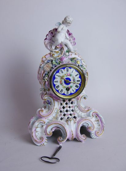 null Polychrome and gilded porcelain clock with rocaille decoration of large shell...