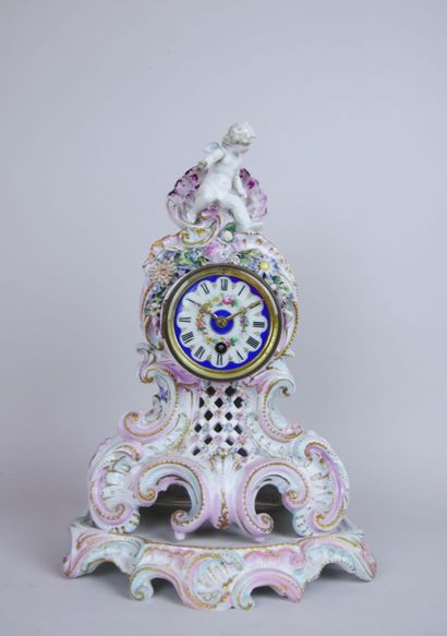 null Polychrome and gilded porcelain clock with rocaille decoration of large shell...