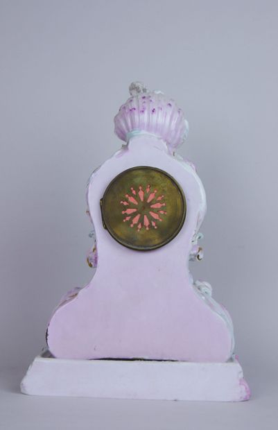 null Polychrome and gilded porcelain clock with rocaille decoration of large shell...