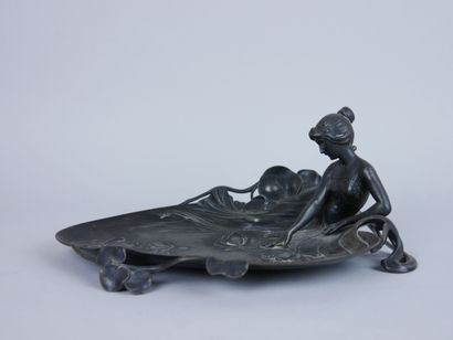 null WMF 

Silver plated pewter tray decorated with a reclining woman admiring water...