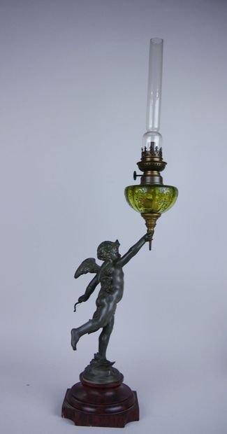null Pair of silver-plated metal oil lamps decorated with winged putti resting on...