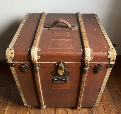 null Travel trunk with wood and metal reinforcements covered with a brown coated...