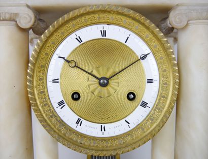 null Portico clock in alabaster resting on four Ionic columns, the entablature decorated...