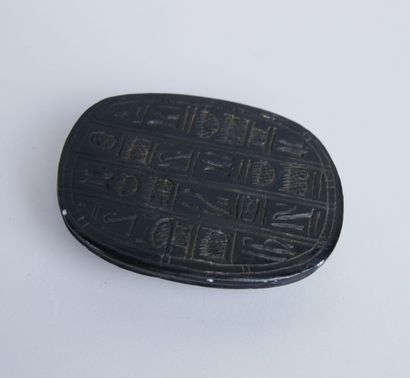 null Souvenirs of a trip around Egypt including : 

A scarab in black cut stone....