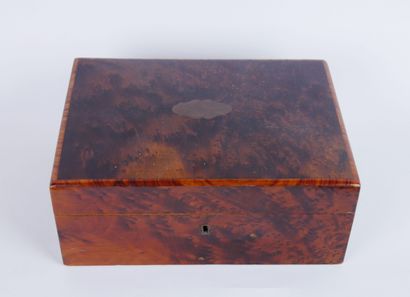 null Mahogany and burl wood jewelry box centered with a stained wood cartouche. The...