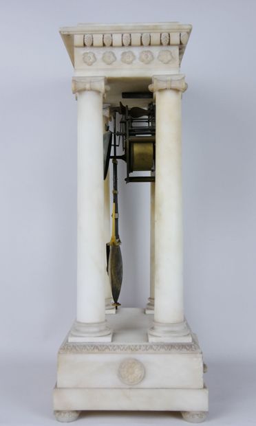 null Portico clock in alabaster resting on four Ionic columns, the entablature decorated...