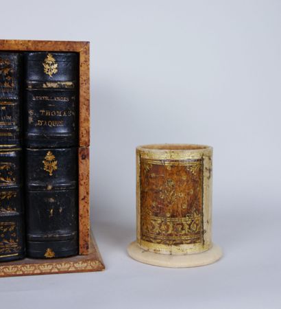 null Office equipment in tan leather with gilded decoration in imitation of the gilding...