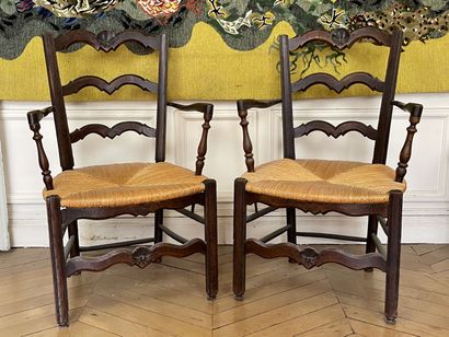 null Pair of armchairs in carved and stained wood, the openwork back, the seat with...