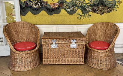 null Pair of woven wicker armchairs of gondola form resting on a circular base. 

Dimensions:...