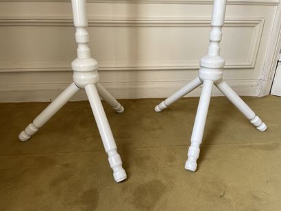 null Set of two coat racks in turned wood and white lacquered resting on a tripod...