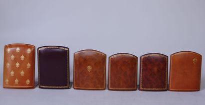 null Set of 14 bookends in wood covered with brown or tan leather gilded with small...