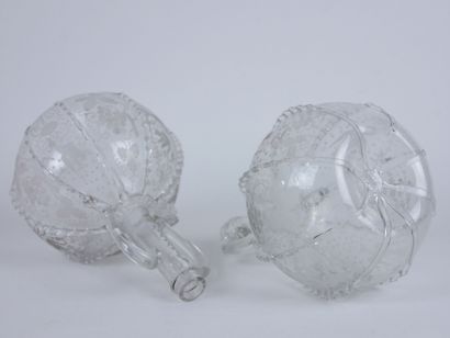 null Two glass decanters in the Venice style, with engraved decoration of birds alternating...